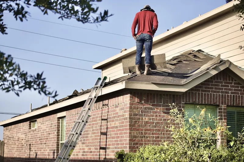 Professional roofer working on a residential roof in Crawfordsville